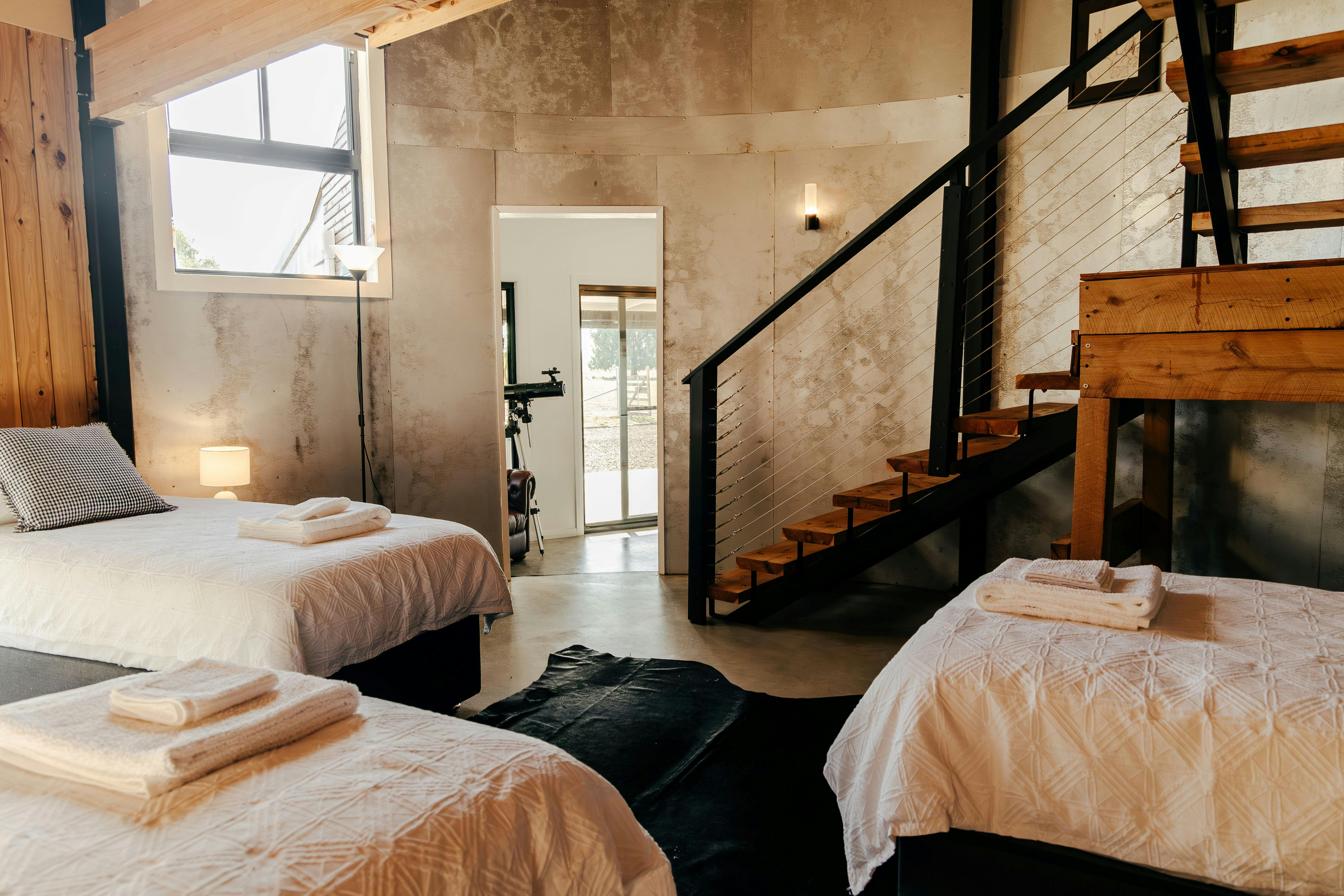 Third bedroom consists of three single beds and a cute play area under the stairs.