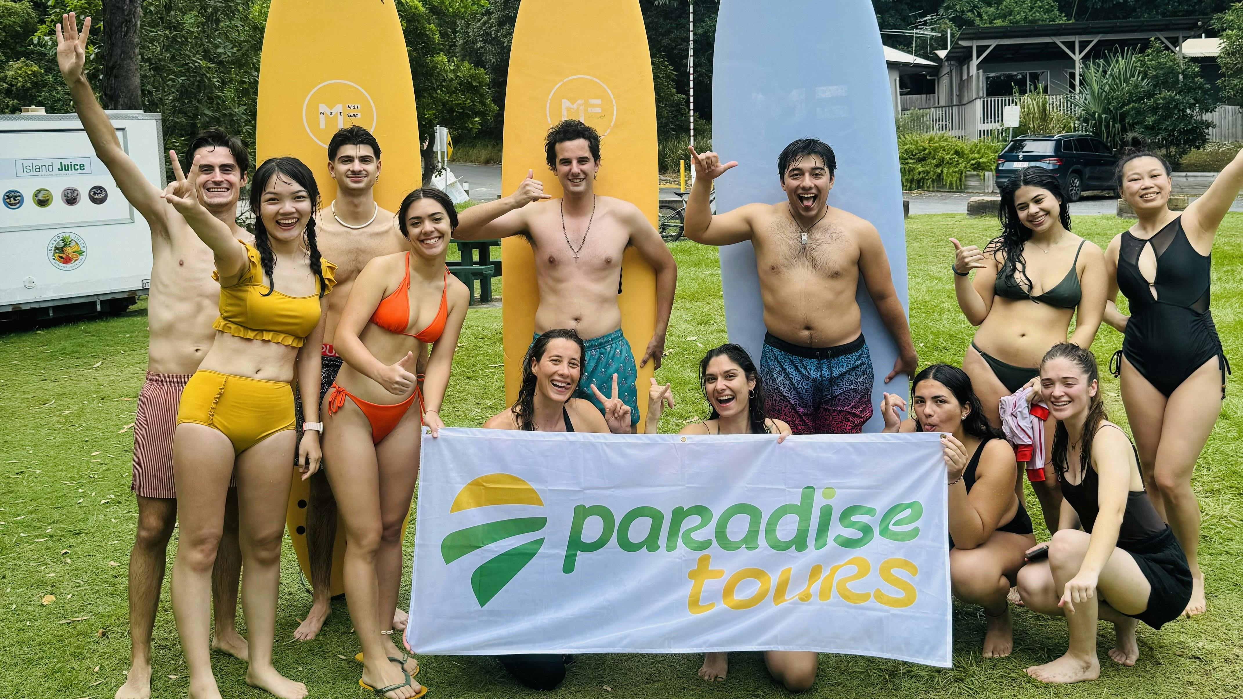 Paradise Tours group with surfboards