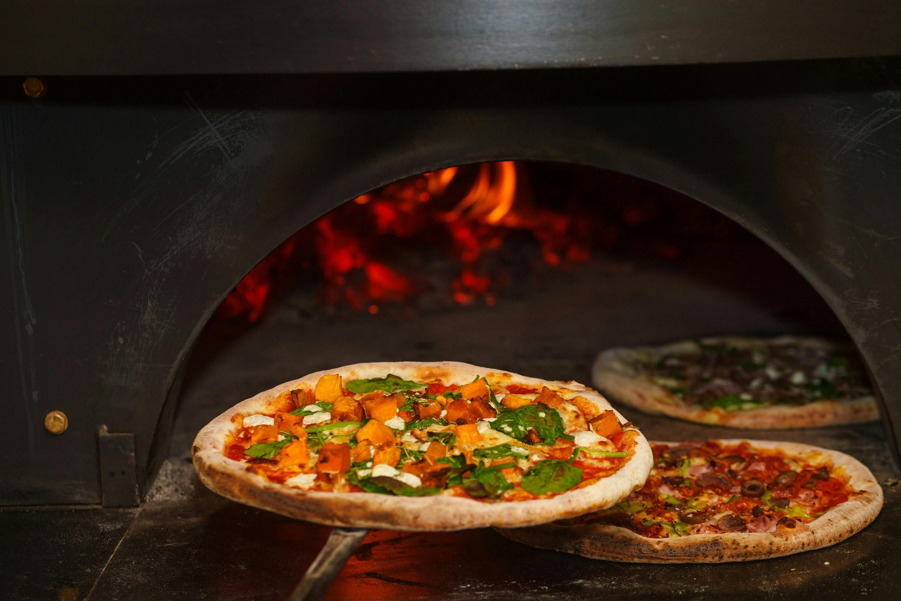 Pizzas in the woodfired oven