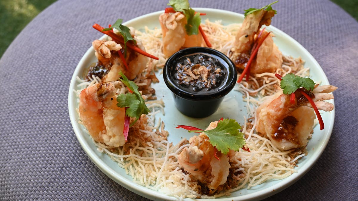 large prawns, lightly battered, deep fried for a few minutes are served with a tamarind sauce