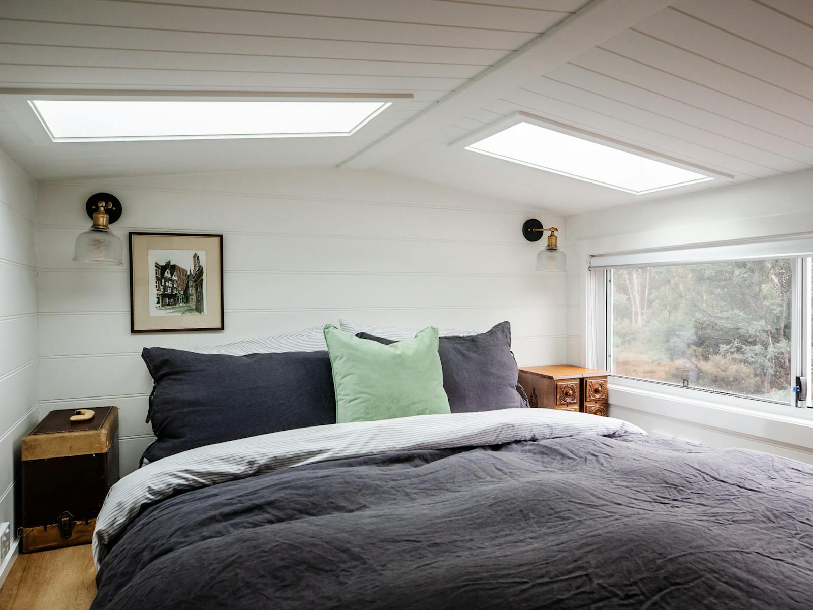 Luxury bedding and skylights in our comfortable loft