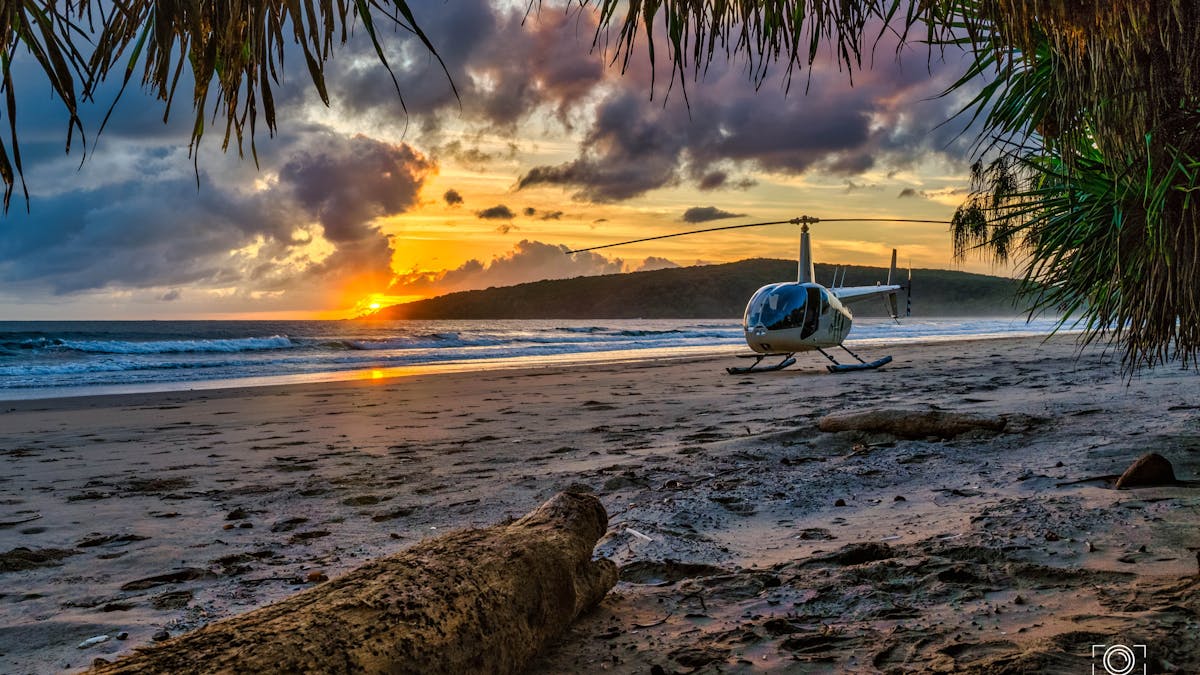 Sunrise over a remote beach off the headland and - stunning colours, RaptAir in the reflective glow.