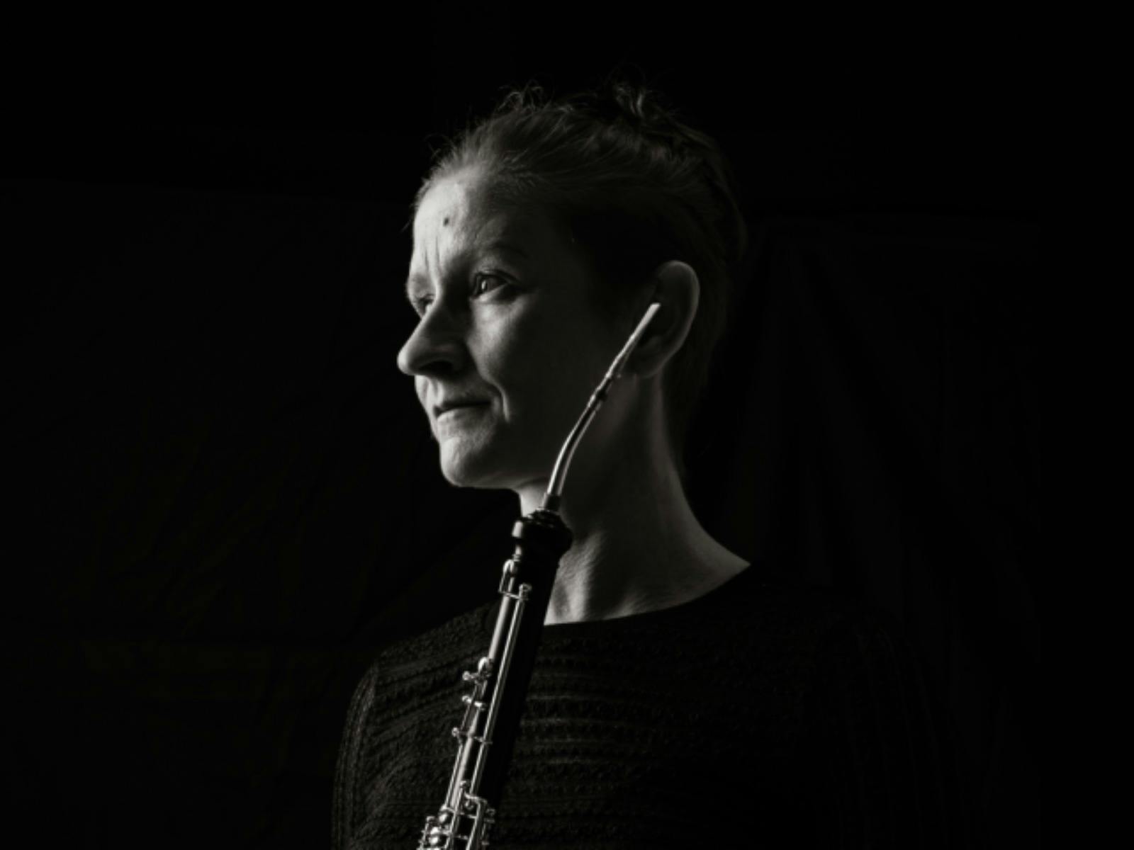 Black-and-white portrait of a cor anglais in profile, looking toward the light Black-and-white portrait of a cor anglais in profile, looking toward the light
