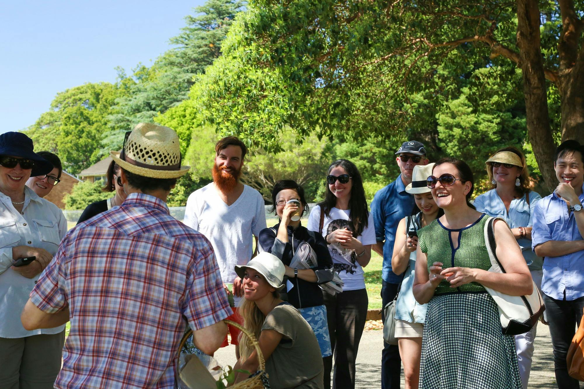 a group of people laughing in the park