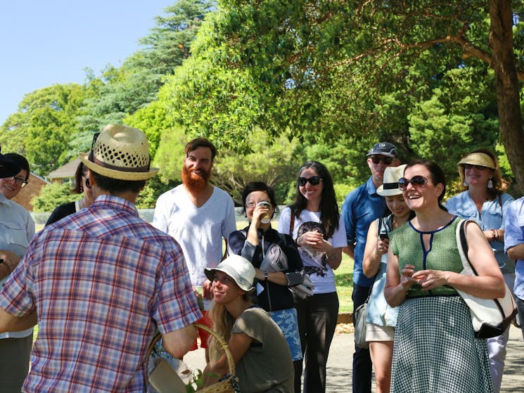 a group of people laughing in the park