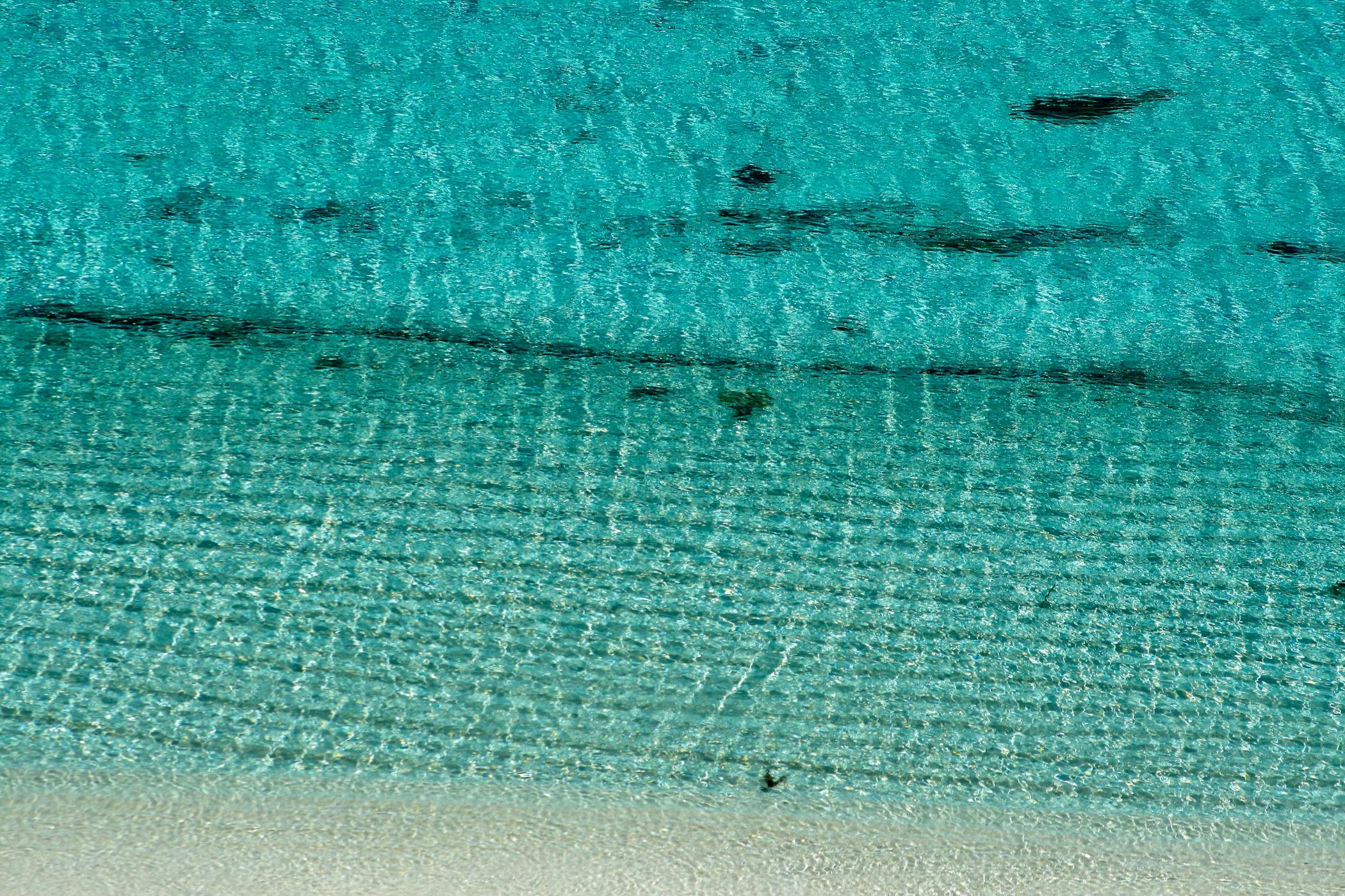 textured clear blue ocean from above