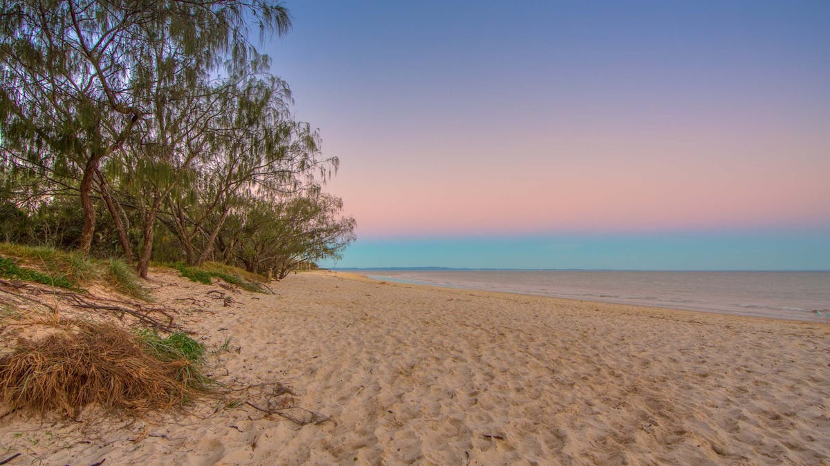 Pink and blue sun set at beach