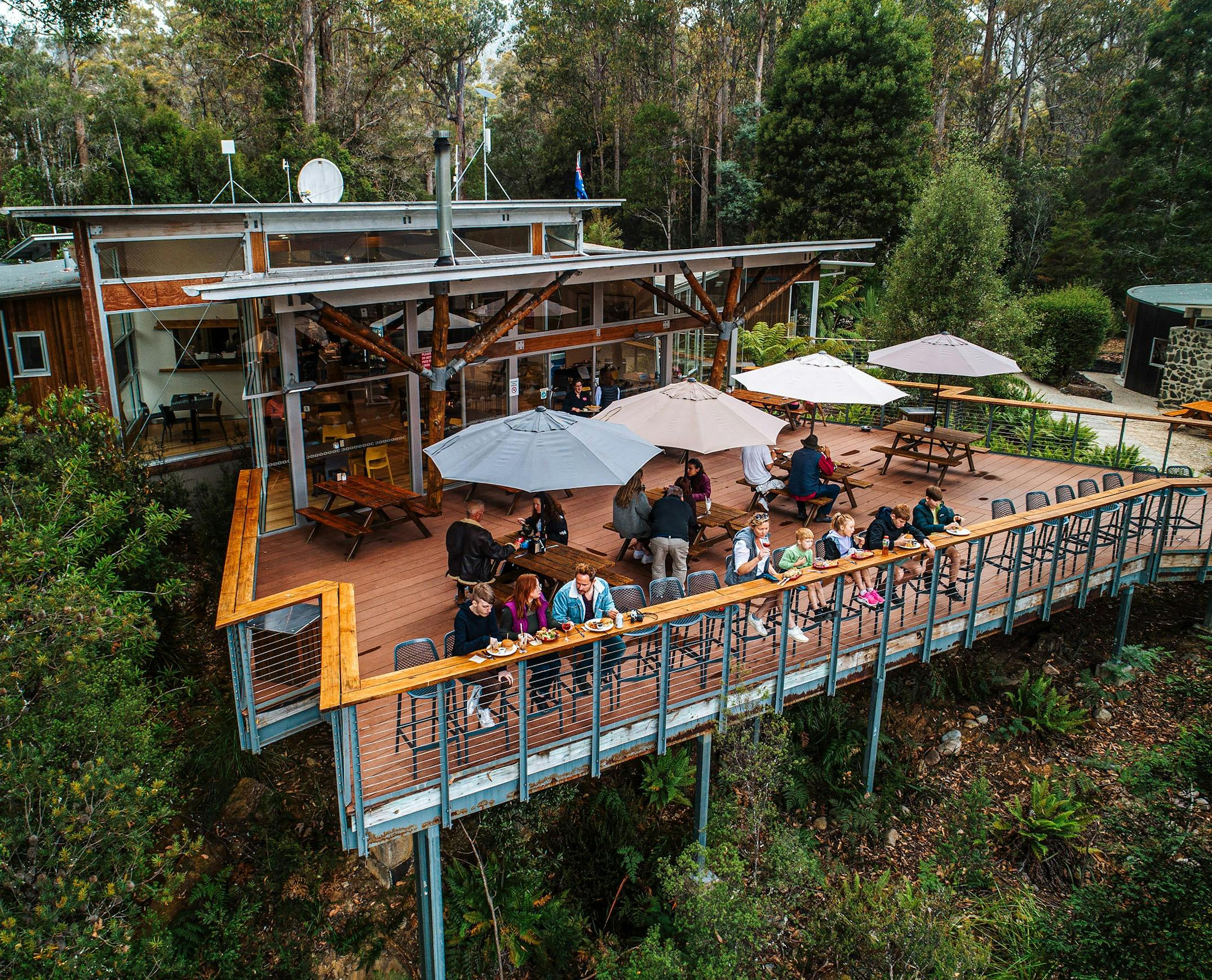 a wide shot of the  Tahune Adventures cafe deck, people sitting outside and enjoying food