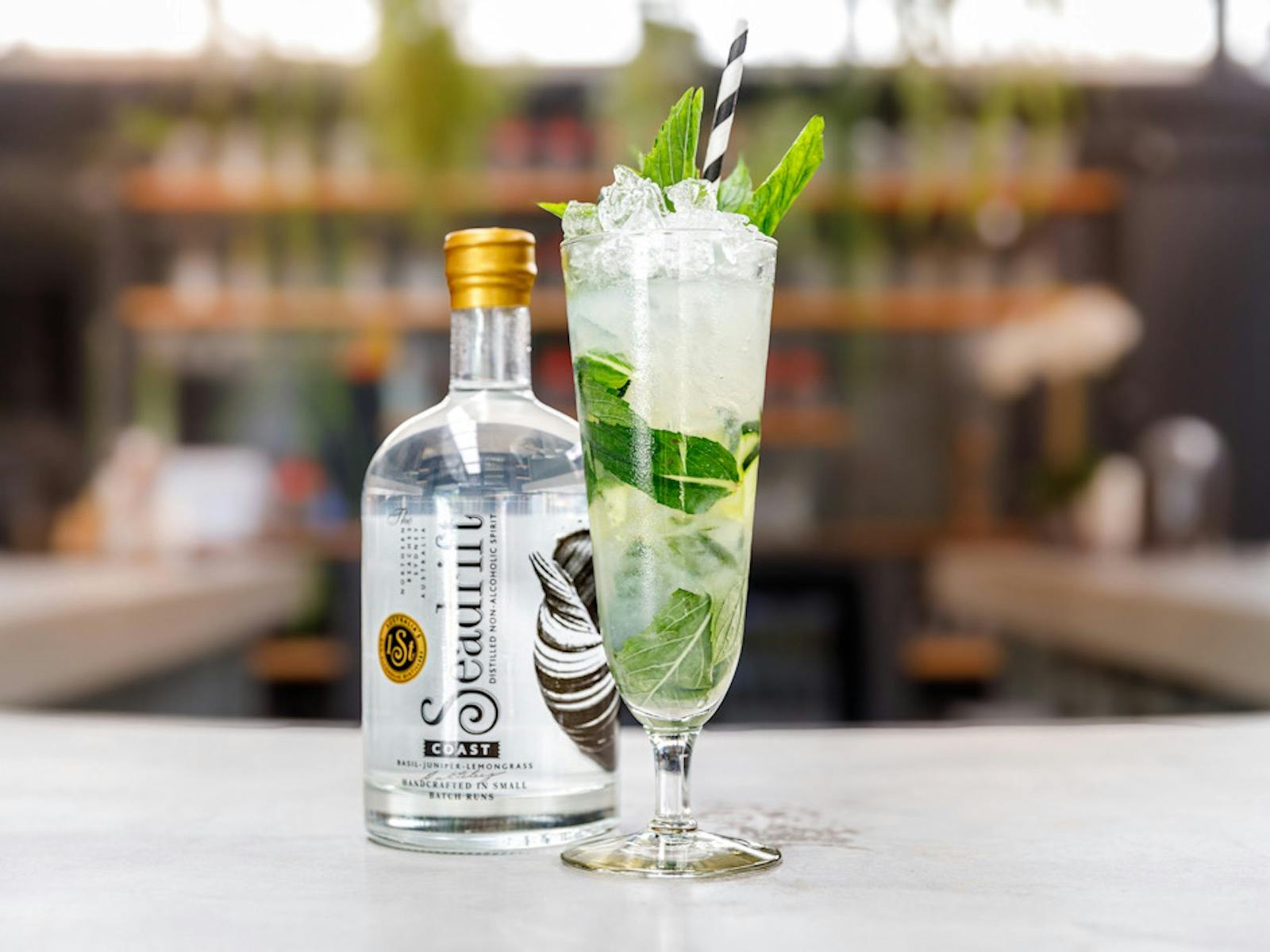 Mojito cocktail beside a Seadrift Coast bottle
