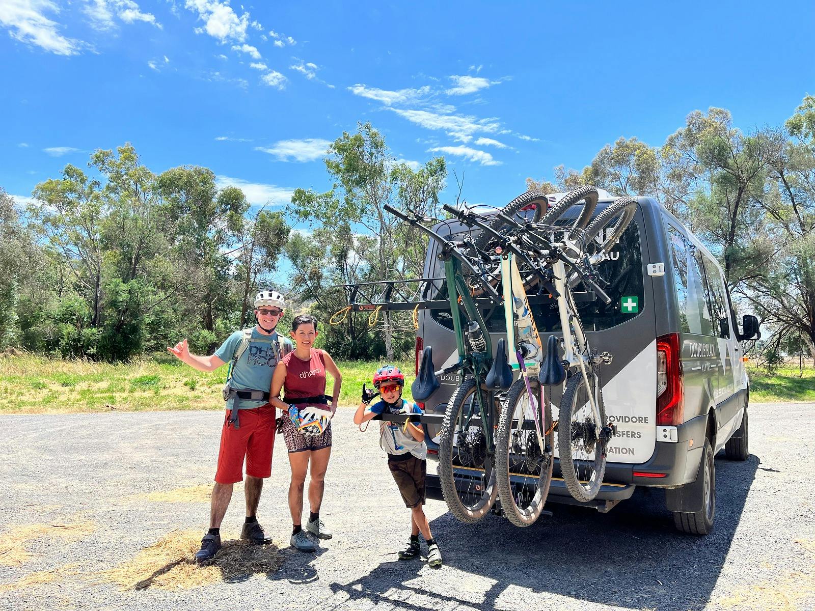 Family finishes their ride along the Great Victorian Rail Trail. Bikes are safely loaded