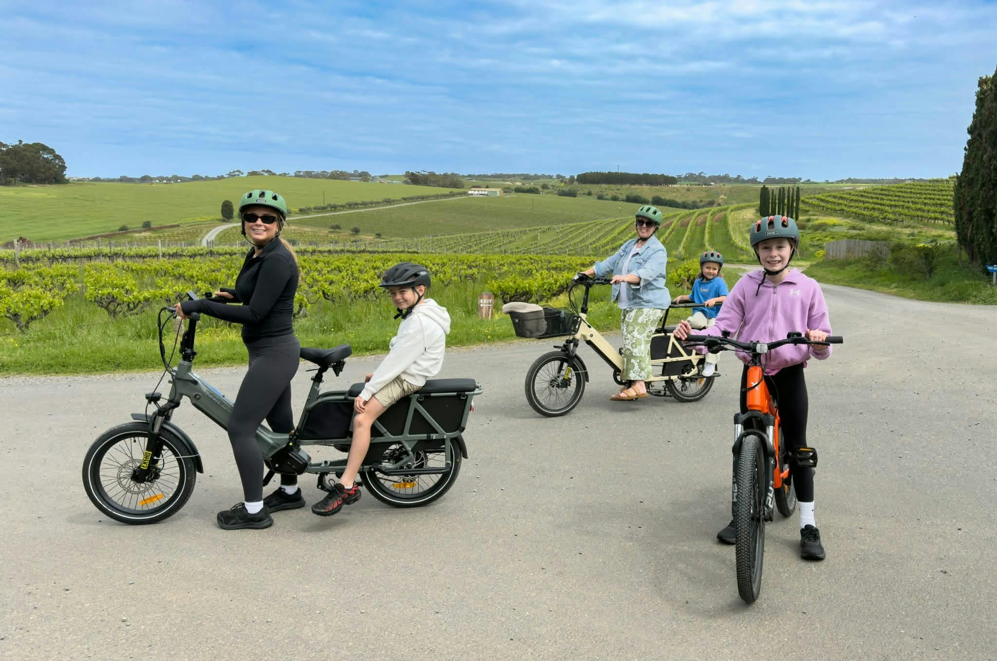 children sitting on the back of cargo e-Bikes