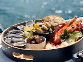 Private Charter seafood platter on board Sunset Charters luxury sailing catamaran in Coffin Bay.
