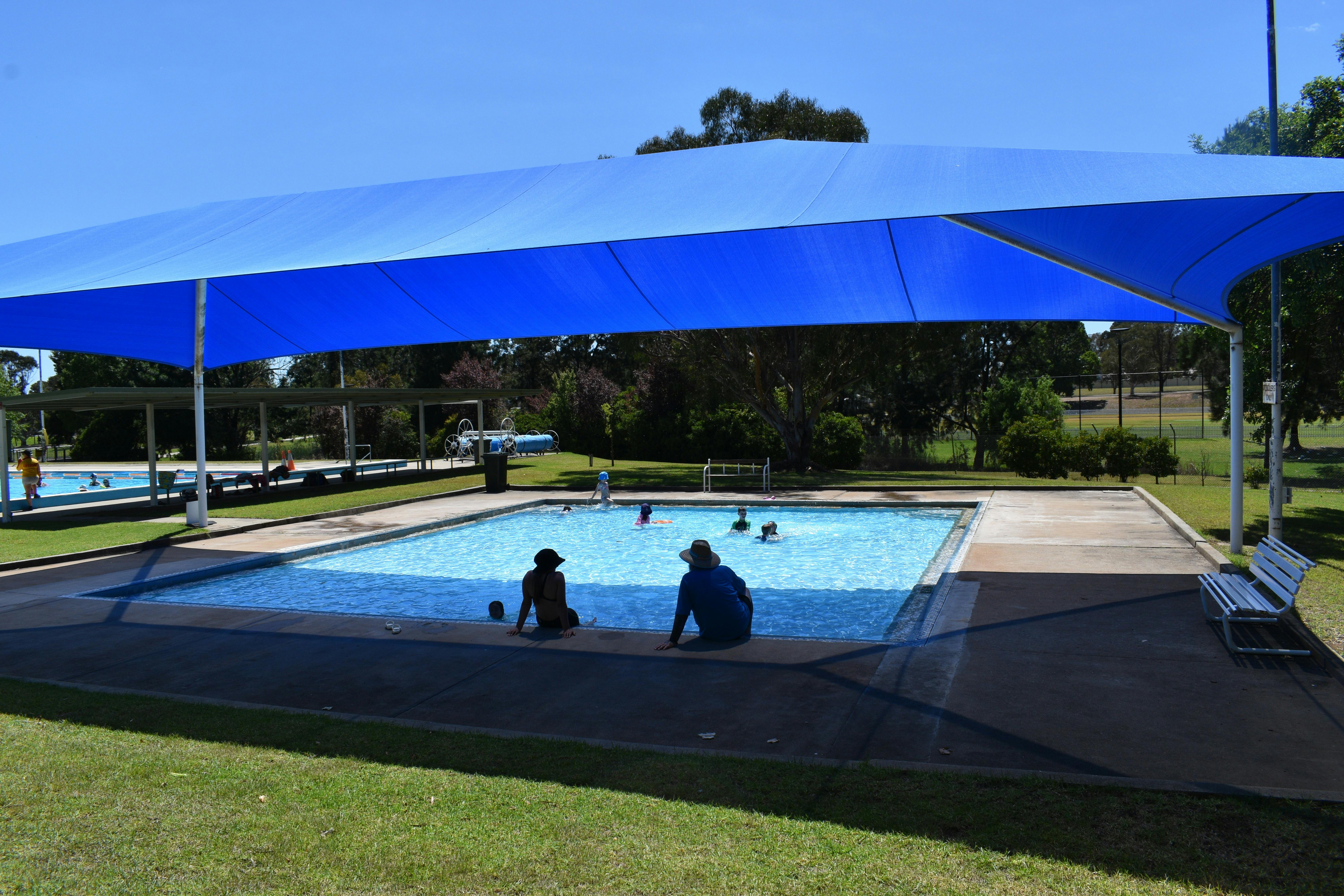 Big shade sale over the kids pool.