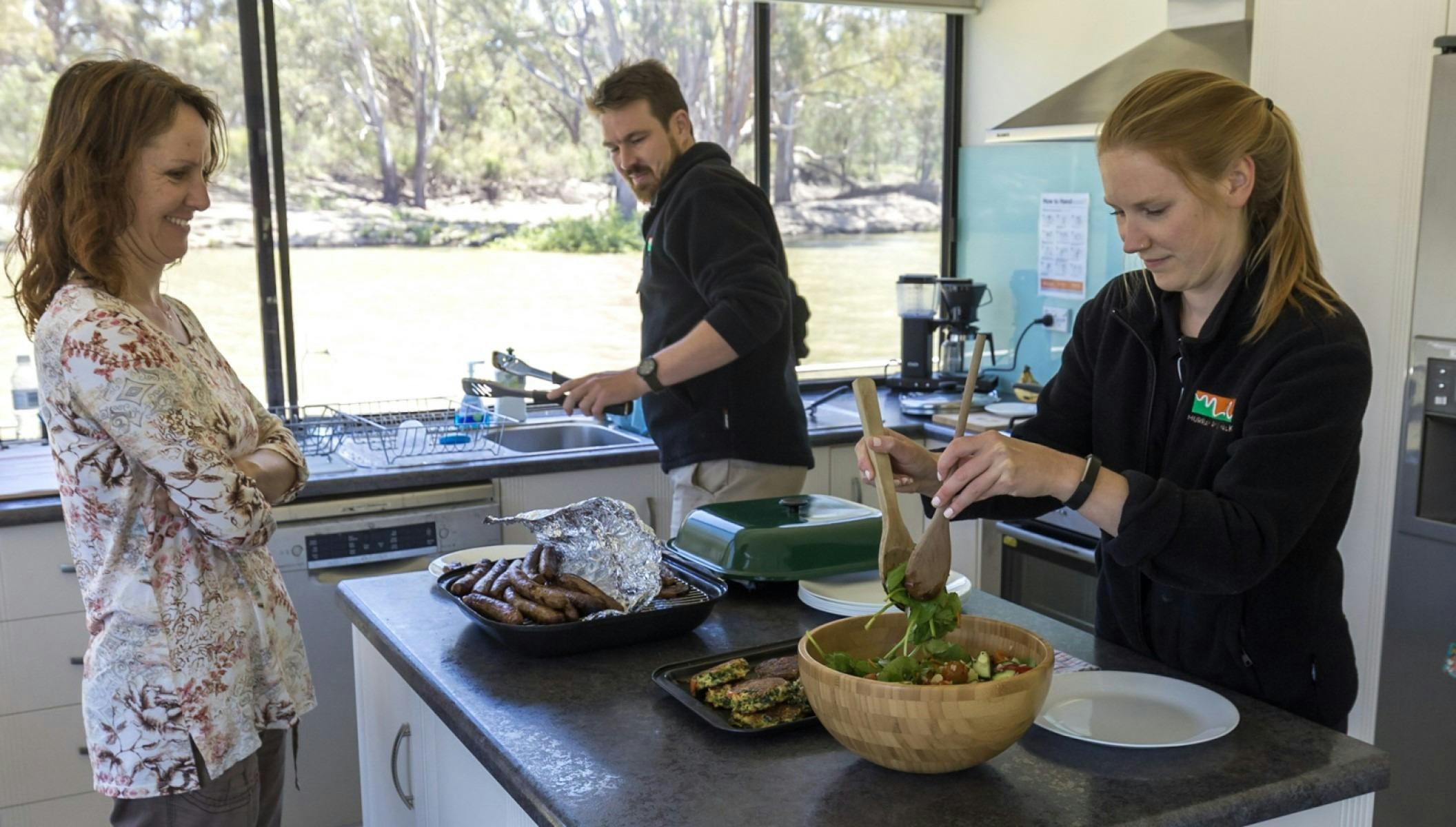 Guides preparing nourish meals on the houseboat