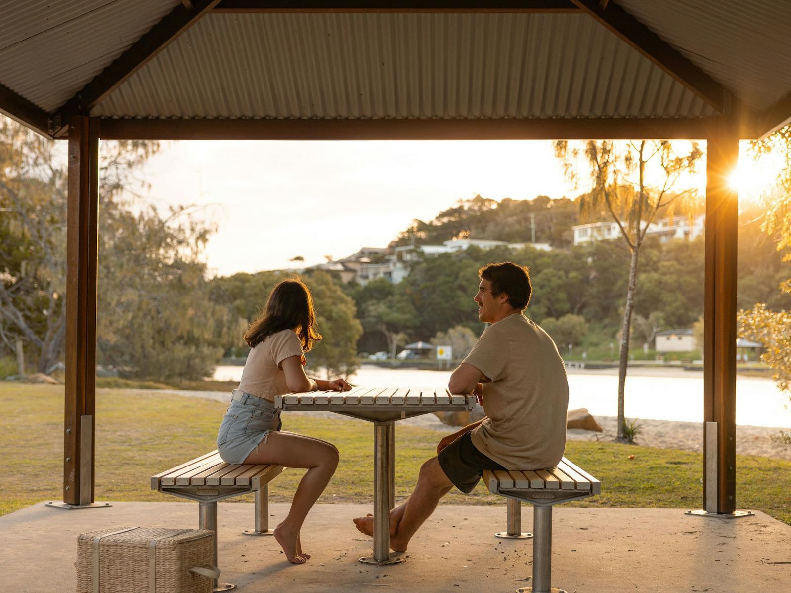 Couple sitting at picnic table