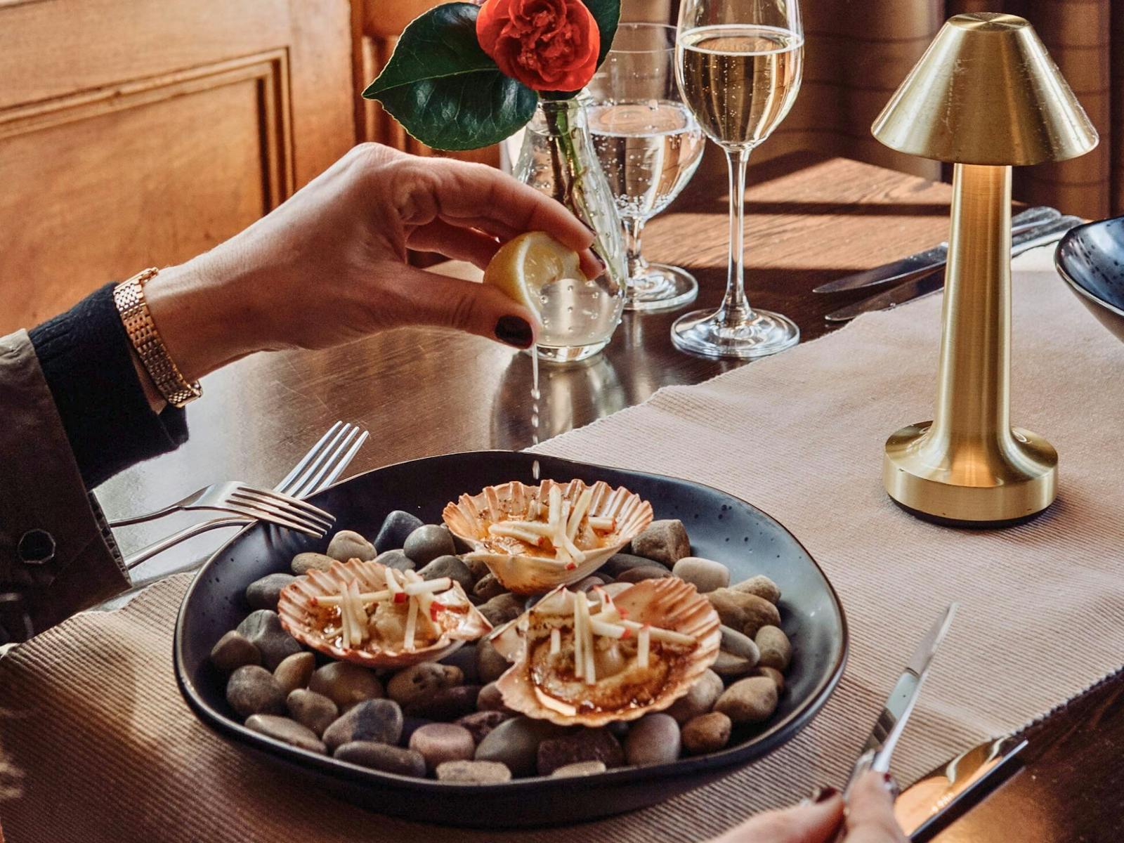 delicios shell roasted scallops with a glass of sparkling wine