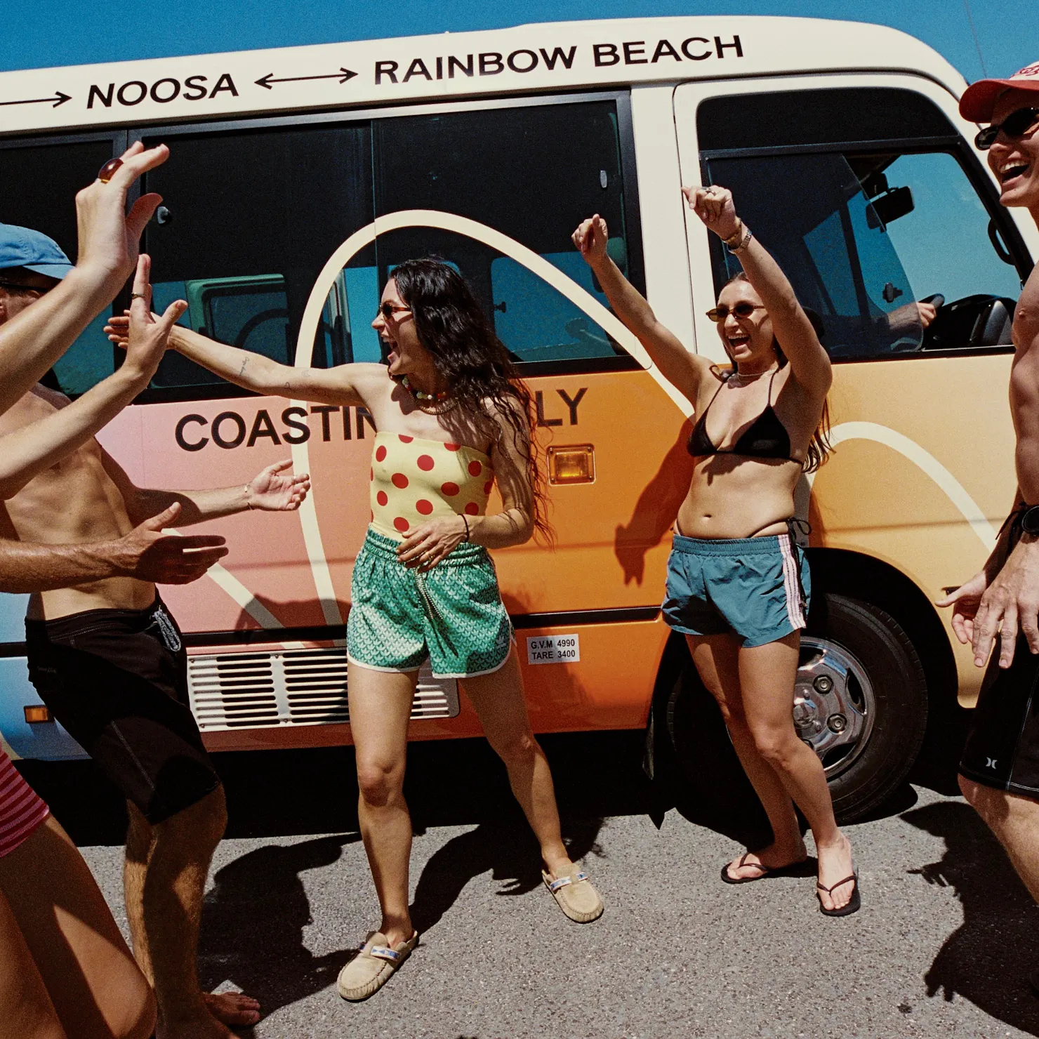 Group of travellers making friends on an East Coast bus trip