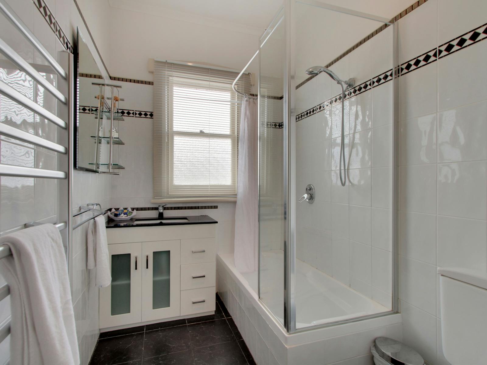 Bath, heated towel rail, hair dryer, toilet
