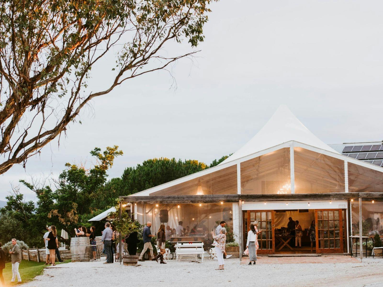 White marquee on the side of a hill