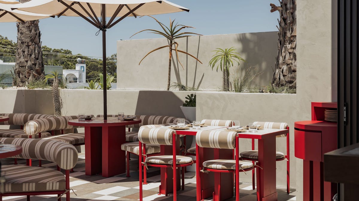 Sueno rooftop tables with open umbrella