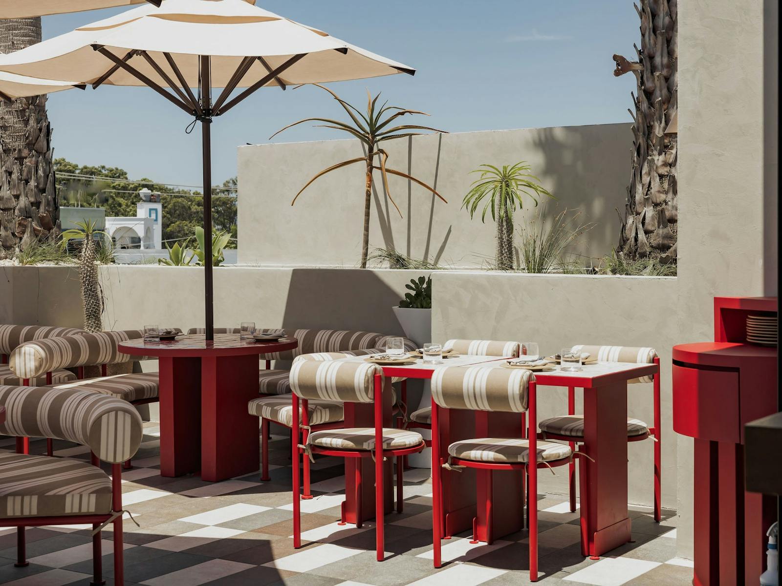 Sueno rooftop tables with open umbrella Sueno rooftop tables with open umbrella