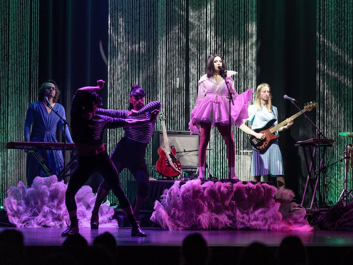 Performers and band members on stage