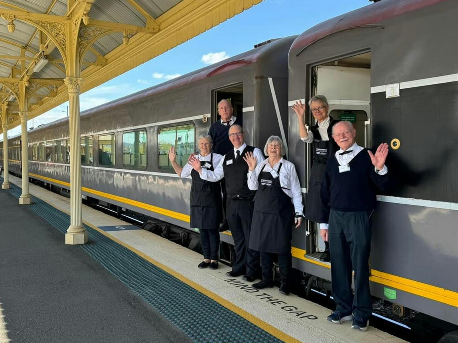 Volunteers greeting passengers