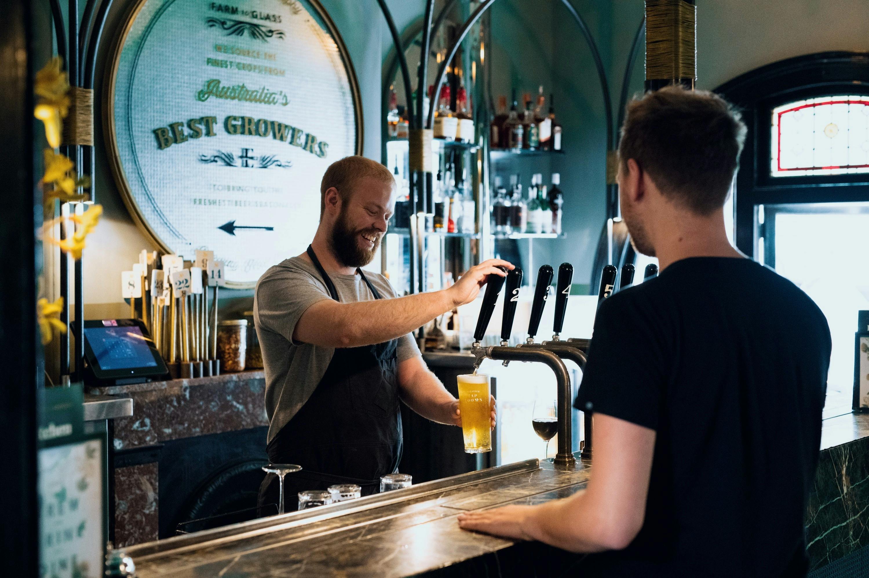 Pouring a cold beer at The Endeavour Tap Rooms in The Rocks.
