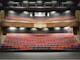 Alpine MDF Theatre, tiered seating, seats purple, orange & gray, edge of stage looking towards seats