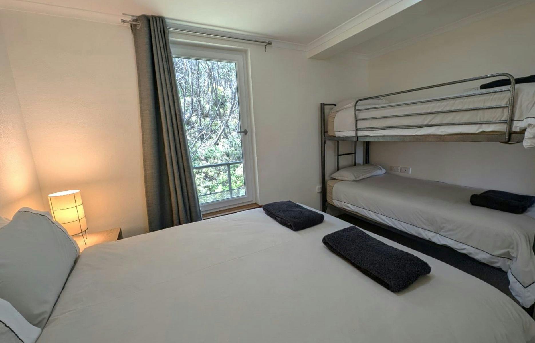 Bedroom with bed and bunk beds