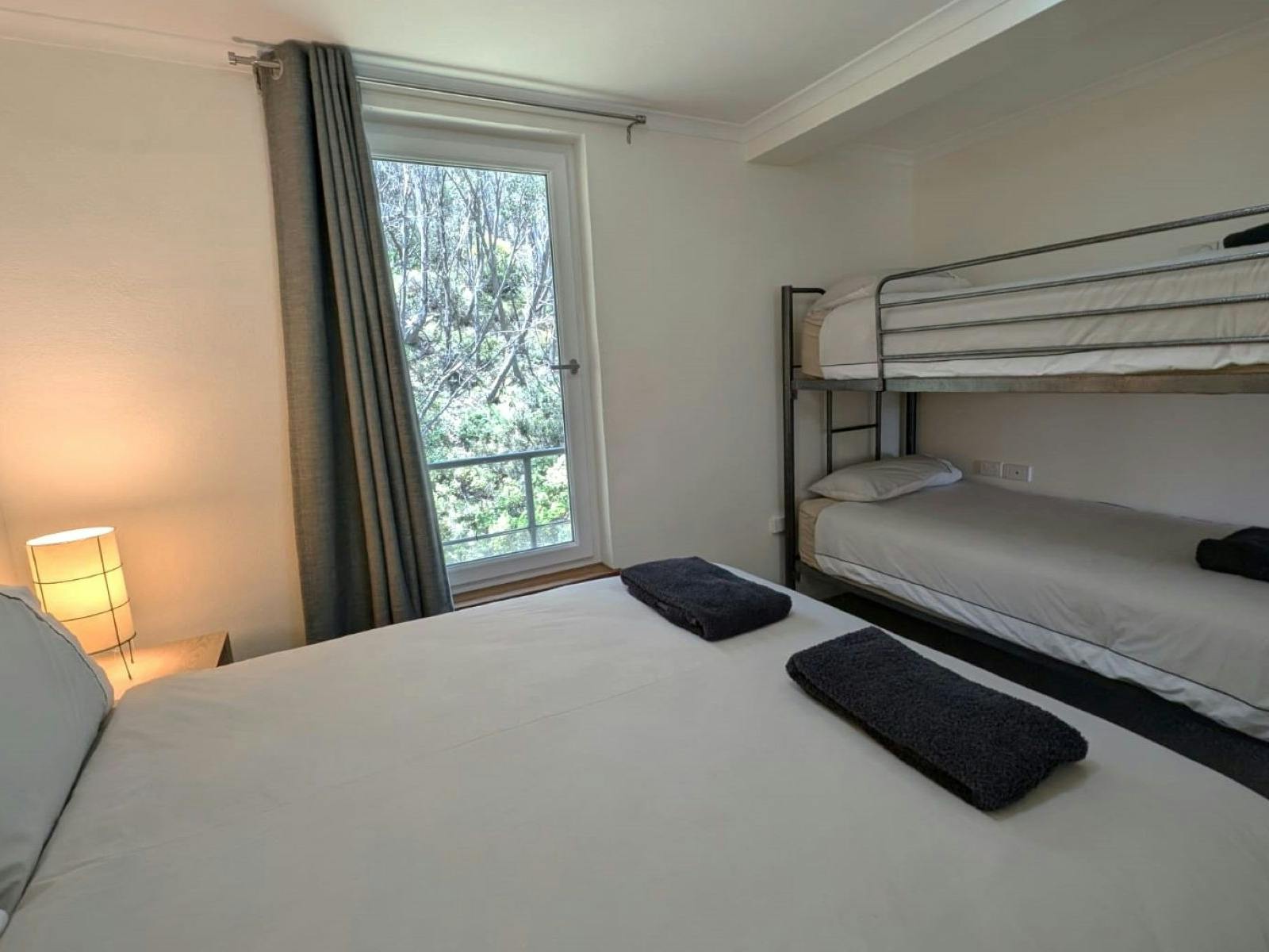 Bedroom with bed and bunk beds