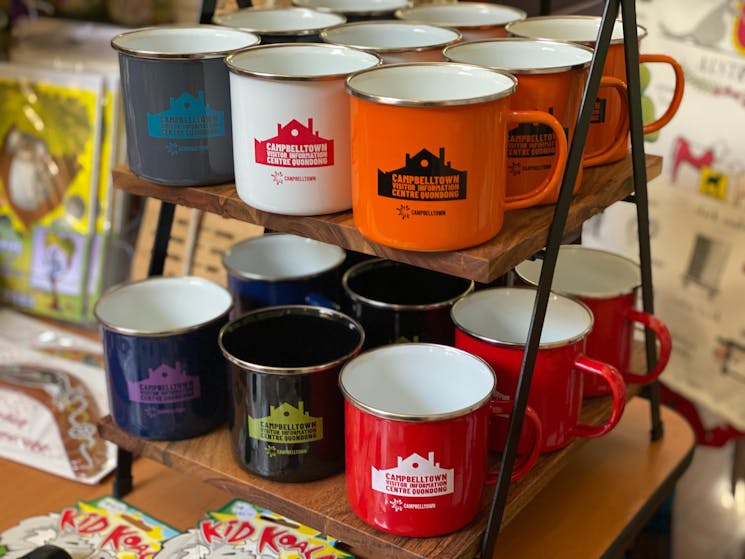 souvenir camping mugs with Campbelltown Visitor Centre logo