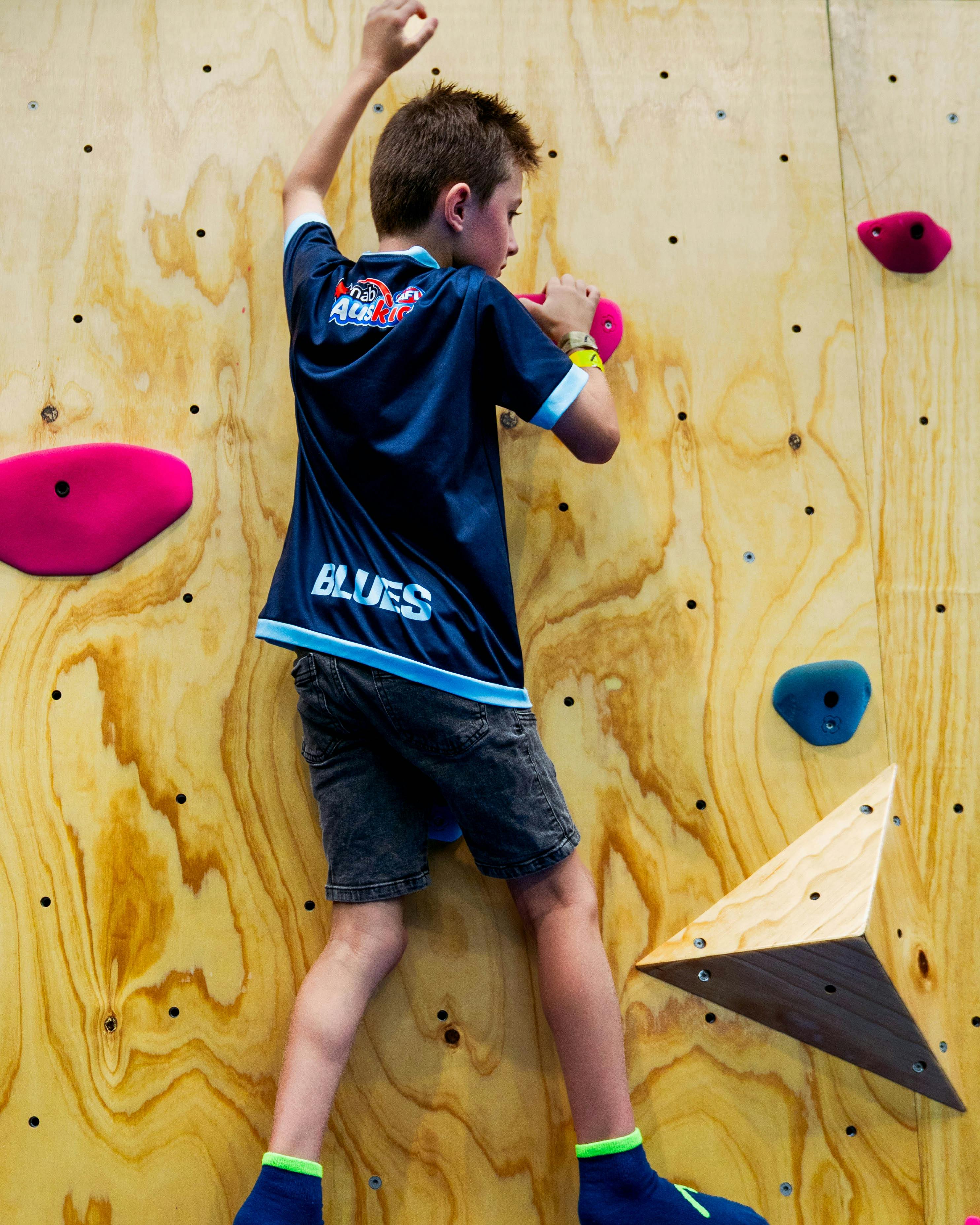 Child on bouldering wall