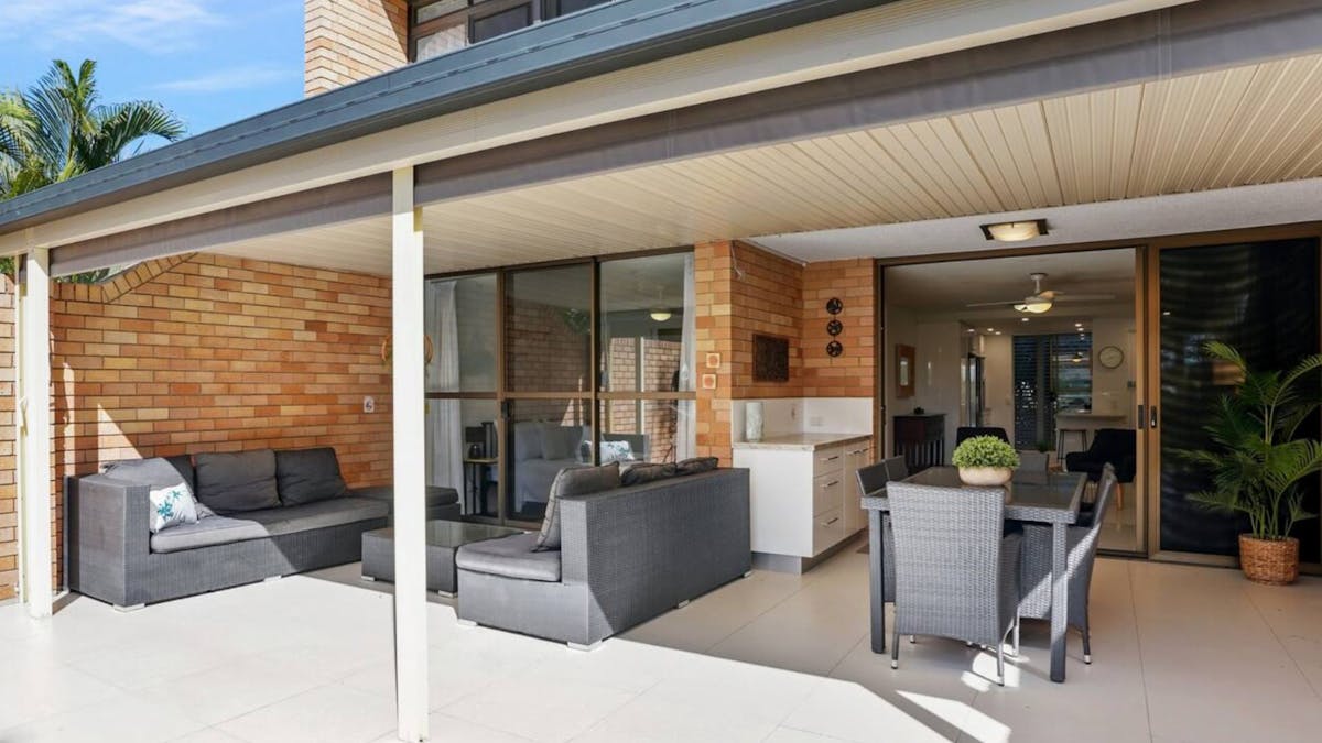 Large balcony space with outdoor lounge and dining