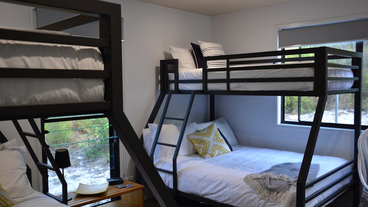 Bunk room has two double beds and two single bunk beds