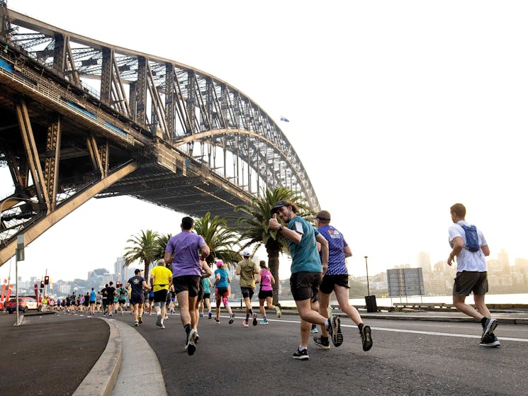 Runners under bridge