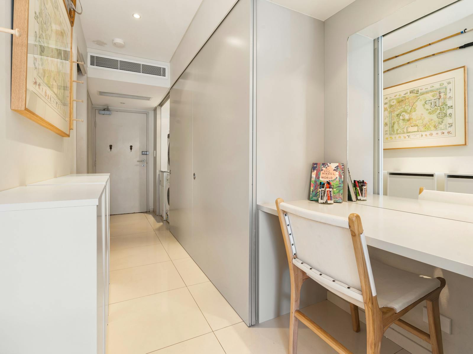 Modern kitchen and living space with a turquoise splashback and a cozy private courtyard.