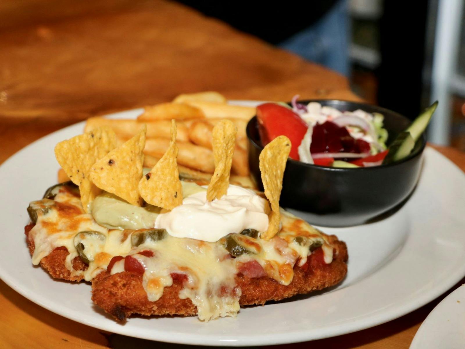 mexican parmy with chips and salad