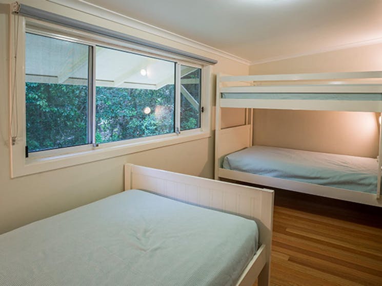 Single and bunk beds in Forest House, Bundjalung National Park. Photo: J spencer/OEH
