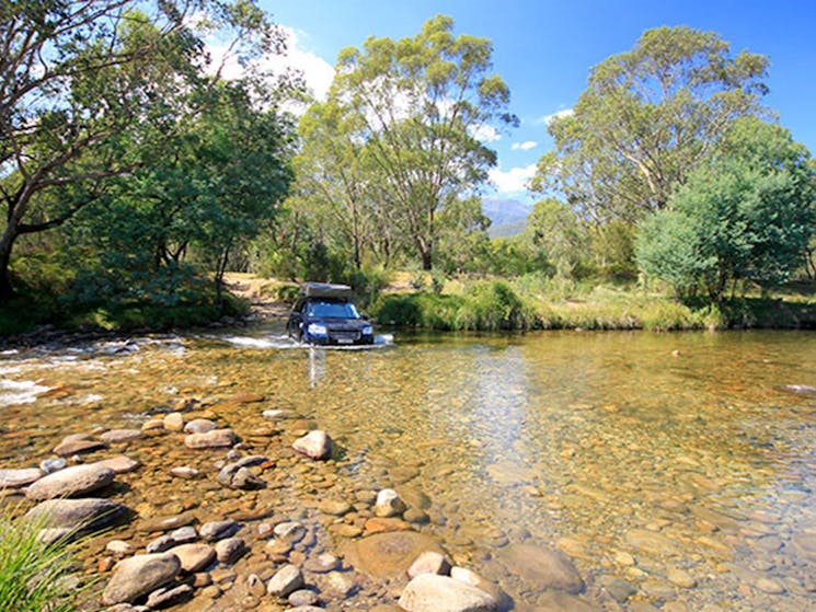 A 4WD crosses the Swampy Plain River in Geehi, Kosciuszko National Park. Photo: Elinor Sheargold/OEH