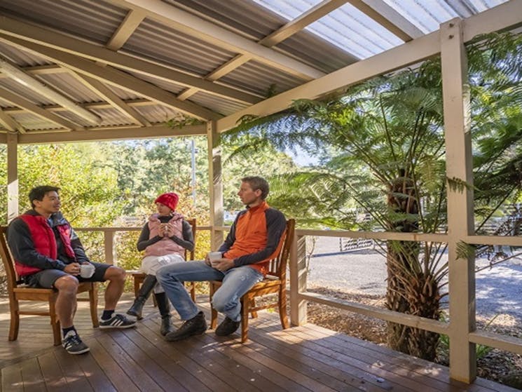 Visitors enjoying a cuppa on the deck at Gibralter House. Photo: John Spencer/OEH