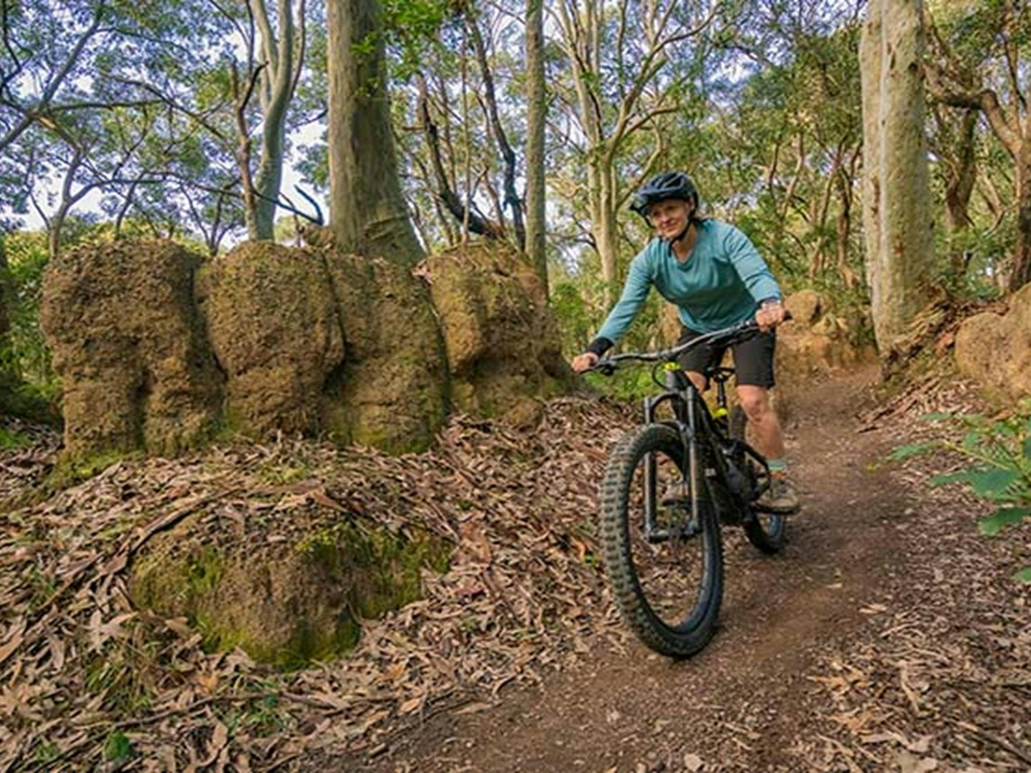Mountain biker in Glenrock State Conservation Area. Photo: John Spencer © DPE