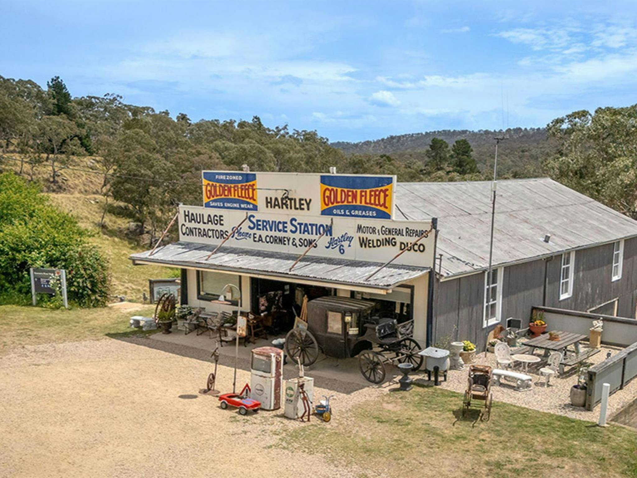 An aerial image of the old Corneys Garage building, now Gold Rush Antiques in Hartley Historic Site.