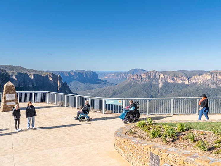 Visitors at Govetts Leap lookout in Blue Mountains National Park. Simone Cottrell/DPE &copy; DPE