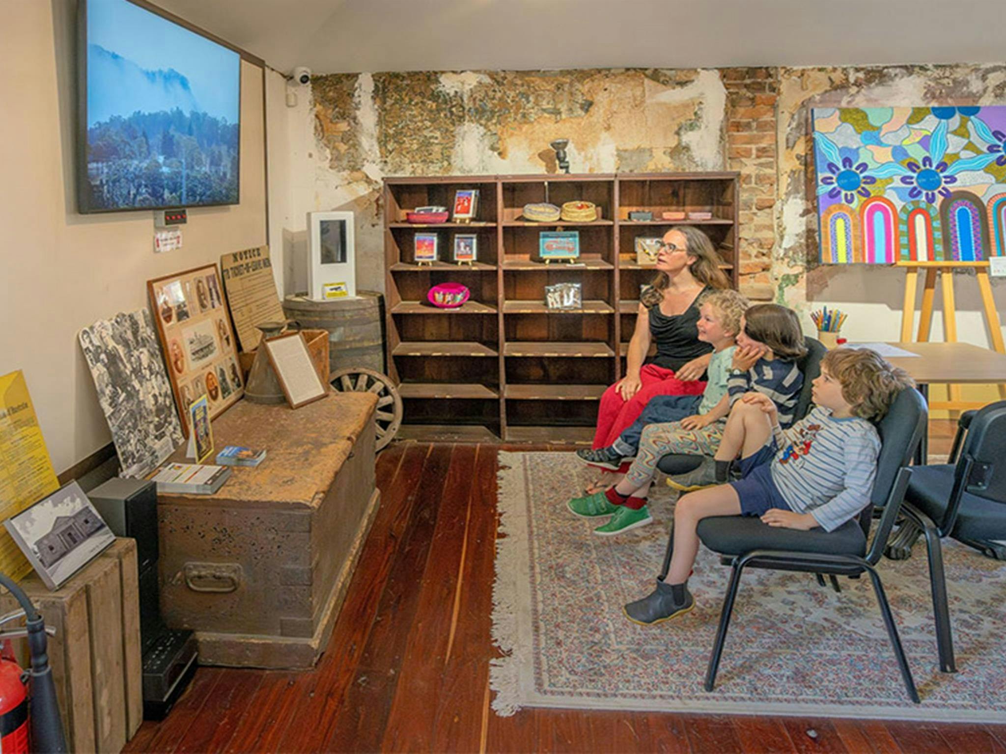 Visitors watching an informative video inside Hartley Historic Site Visitor Centre. Credit: John