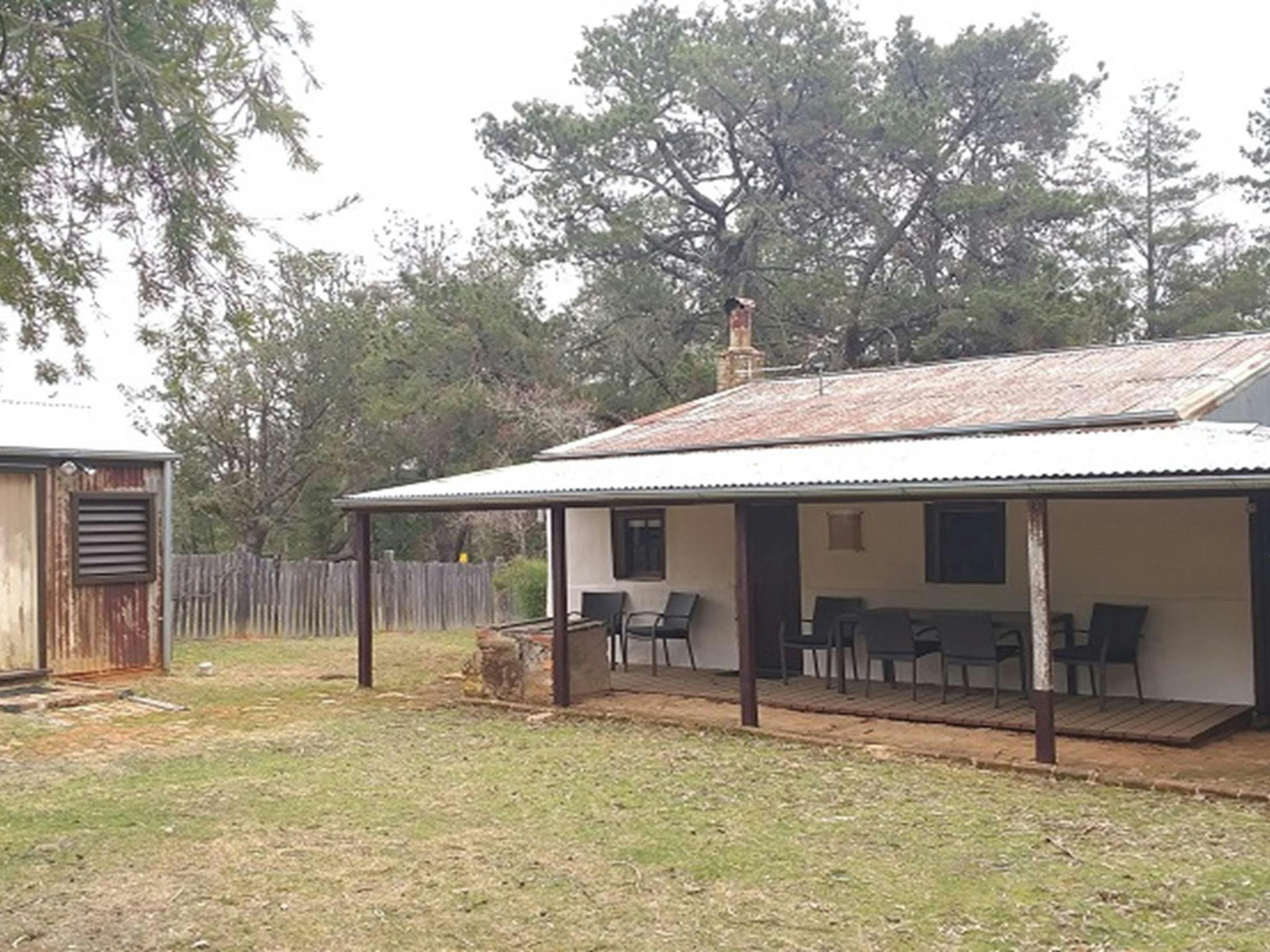 Verandah and outdoor seating at Hill End Pines Cottage, Hill End Historic Site. Photo: Brett
