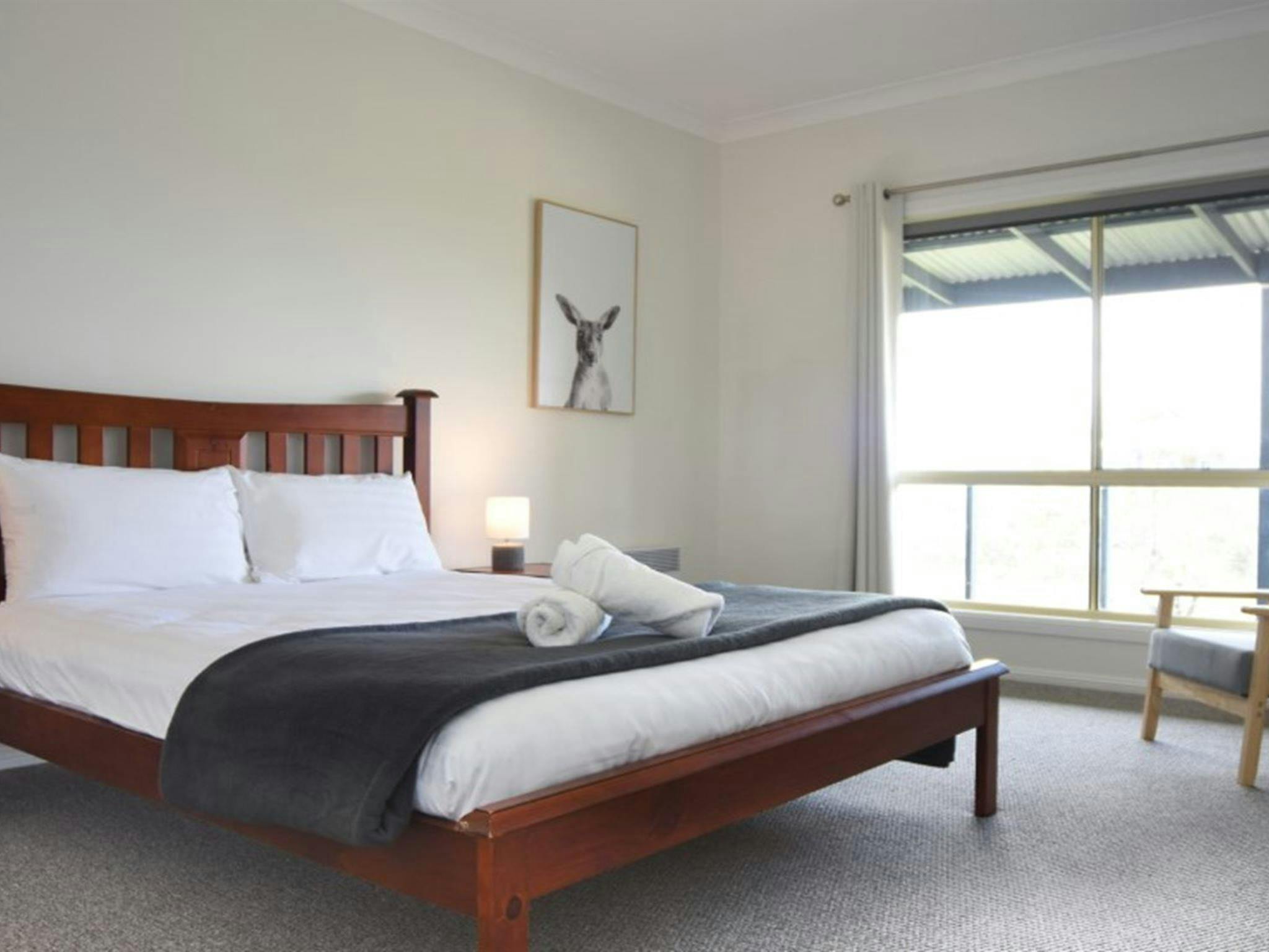 A bedroom with queen bed in Honeyeater Homestead, Capertee National Park. Photo: Steve Garland