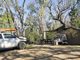 A tent with ute parked next to it in Horton Falls campground and picnic area, Horton Falls National