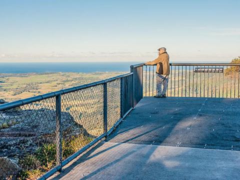 A man stands at Jamberoo lookout, Budderoo National Park. Photo credit: Michael Van Ewijk &copy;