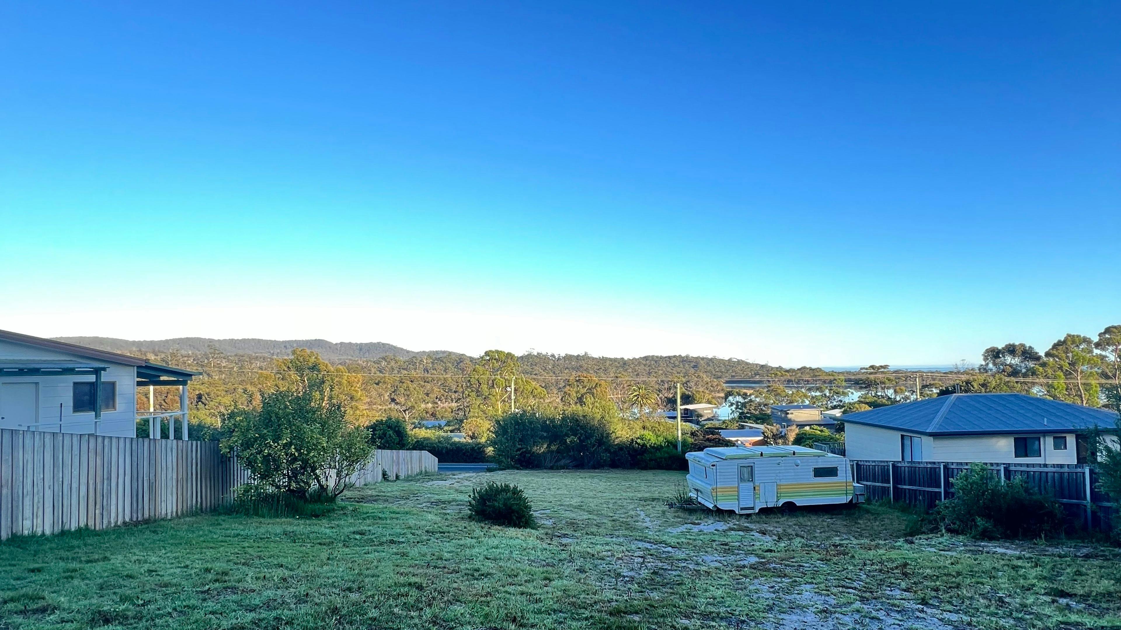 Looking out over our peaceful block of land, ready for your perfect camping setup – photo taken from the rear boundary.